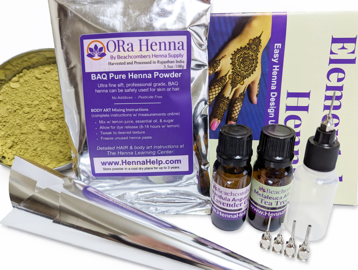 close up of essential henna kit for beginners includes henna powder, essential oils, applicator bottle, and henna booklet