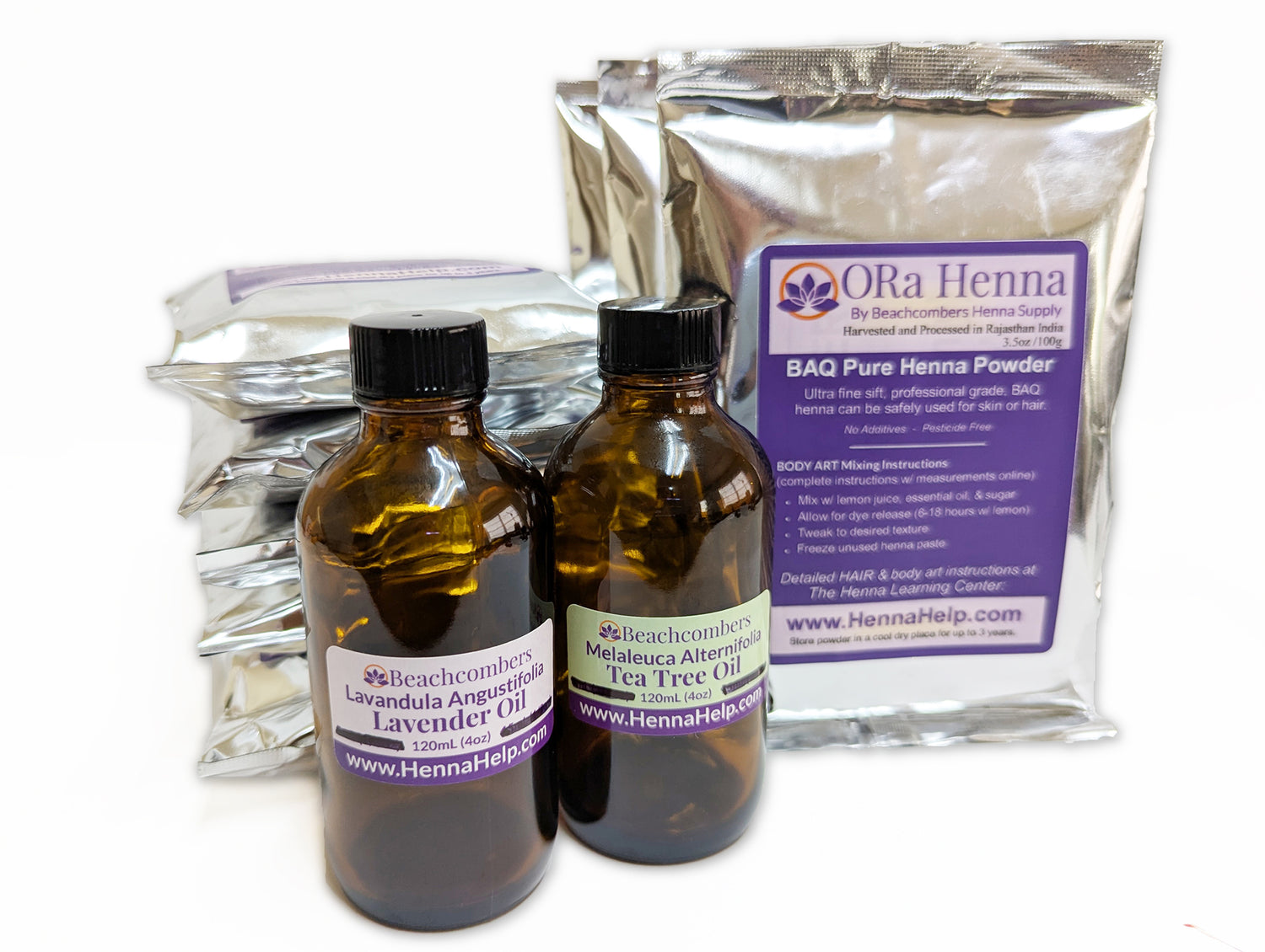 Picture of ten 100g bags Kilo of BAQ ORa henna powder with a bottle of tea tree oil and lavender oil