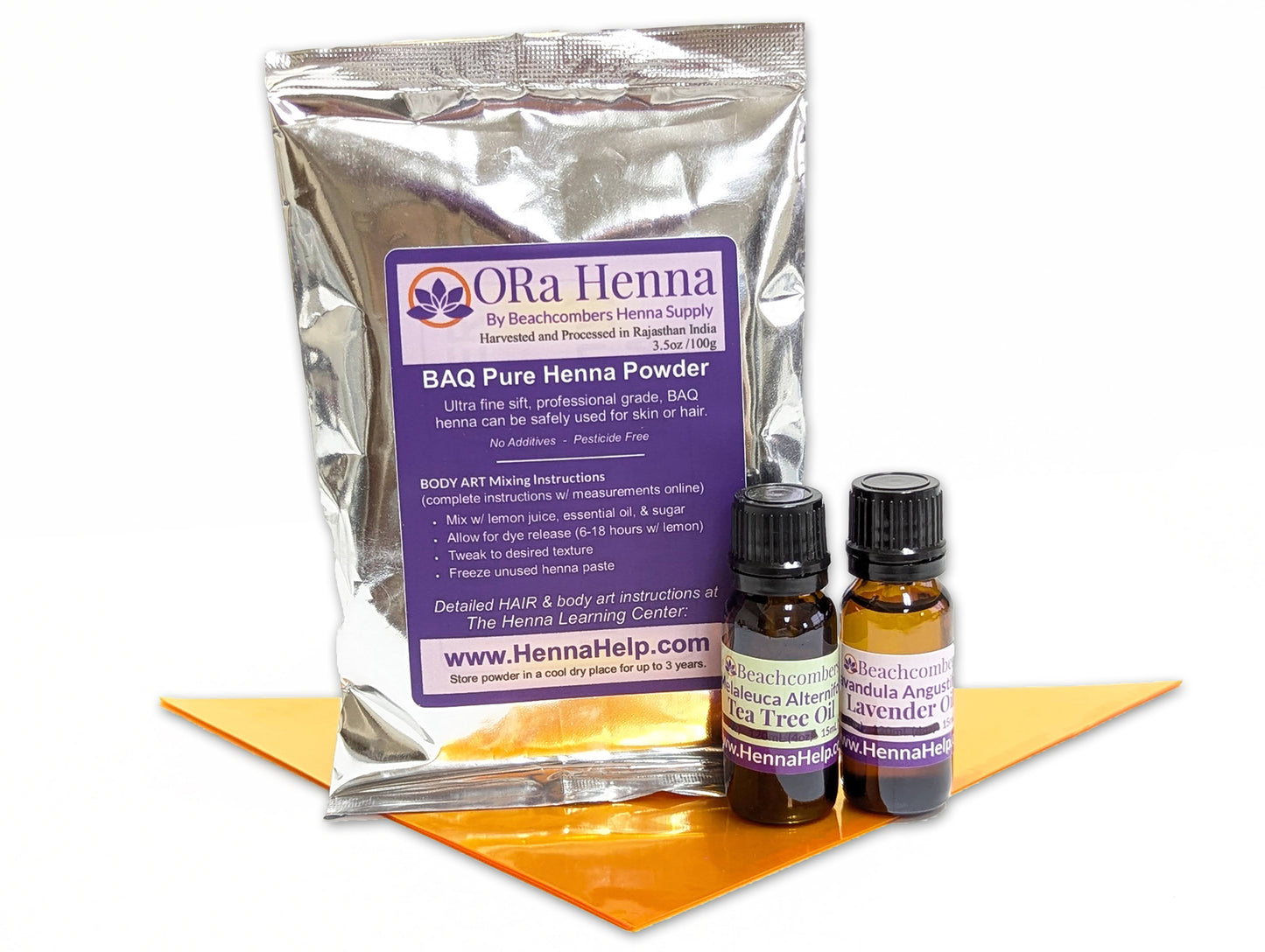 Picture of 100g bag of BAQ ORa henna powder with a bottle of tea tree oil and lavender oil - Henna Refill Kit