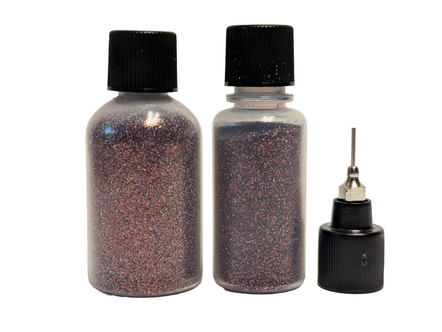 Two bottles of blood red glitter with and a small  syringe tip on a white background