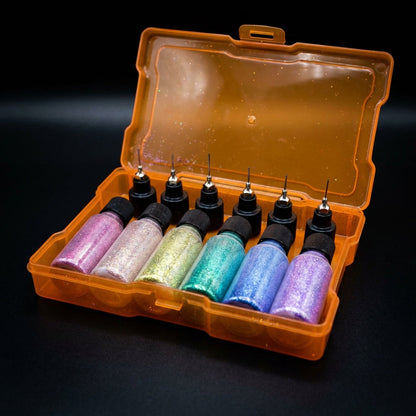 A close-up, product-focused shot of the Rainbow Glitter Gift Box set against a plain dark background to emphasize the colors and sparkle. Studio HDR lighting highlights the glitter’s body-safe, shimmering particles, with a narrow-depth-of-field to keep the